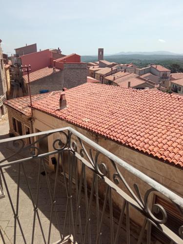 a view of a building with red tile roofs at Violivia in Aggius
