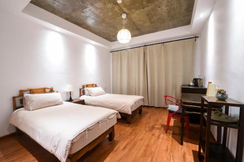 Katil atau katil-katil dalam bilik di 桐庐舍予民宿 Tonglu Sheyu Country House
