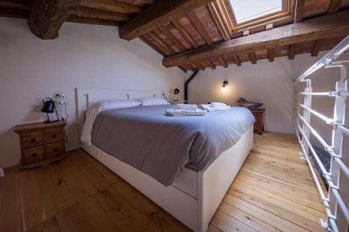 Katil atau katil-katil dalam bilik di Santa Fiora Ospitalità Diffusa - La Casa del Miccio