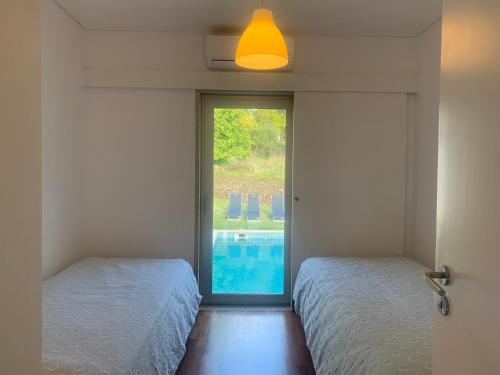 Postel nebo postele na pokoji v ubytování Villa do Val Seixas - Piscina Privada