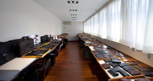 a row of desks in a room with windows at Nuevo Torreluz in Almería
