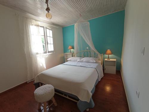 A bed or beds in a room at Sweet Maisonette in Corfu Town