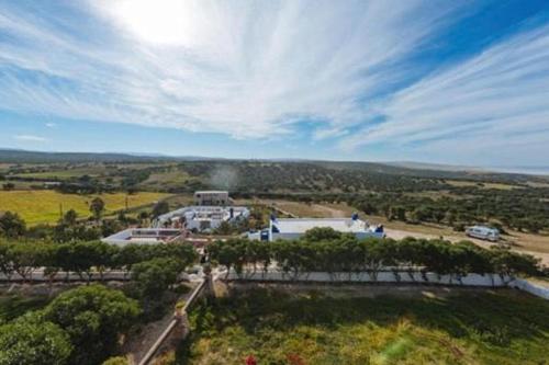 an aerial view of a large building in a field at Room in Guest room - Pretty room in villa Lair De La Mer, in Sidi Kaouki in Sidi Kaouki