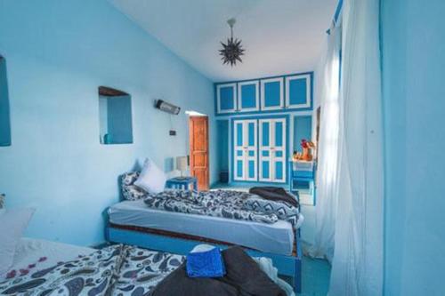 Een bed of bedden in een kamer bij Room in Guest room - Pretty room in villa Lair De La Mer, in Sidi Kaouki