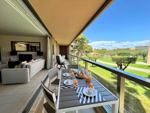 a balcony with a table with food on it at Albufeira Salgados Premium 1 With Pool by Homing in Guia