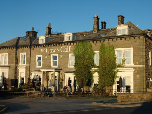 a large brick building with a sign on it at Garden Cottage in Ilkley