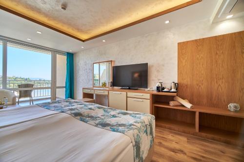 Postel nebo postele na pokoji v ubytování Bilyana Beach Hotel - All Inclusive & Free Beach Access