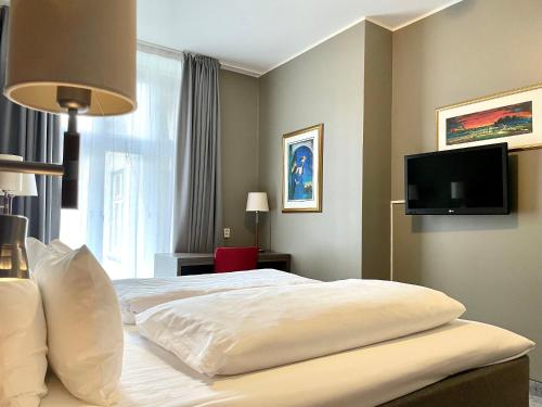 Télévision ou salle de divertissement dans l'établissement Karl Johans gate 35
