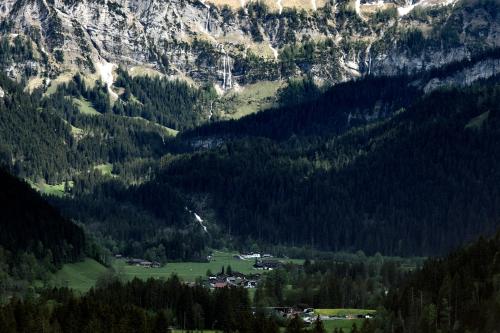 a view of a mountain with a village in a valley at Schweiz ,Lenk Ferienwohnung,Kinderfreundl,Seniorenfreundlich in Lenk