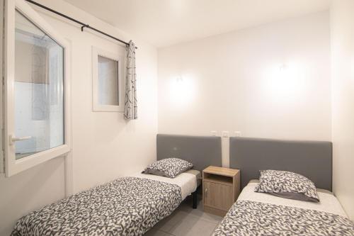 Llit o llits en una habitació de Le Mas des Bois