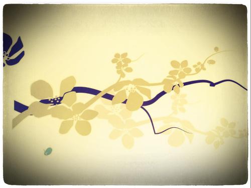 an illustration of a branch with flowers and butterflies at B&B Borgomarino in Pescara