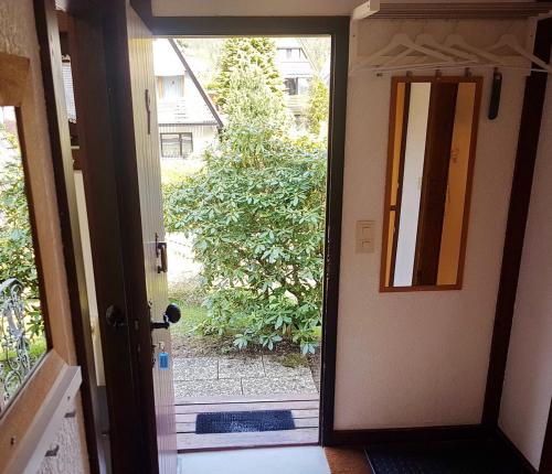 an open door with a view of a yard at Seewiese in Nagel