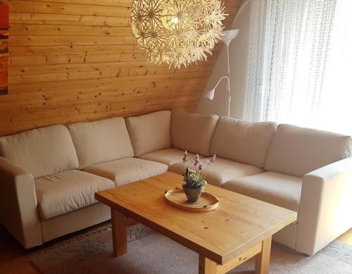 a living room with a couch and a coffee table at Seewiese in Nagel