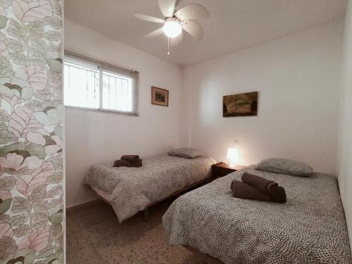 Posteľ alebo postele v izbe v ubytovaní Nerja Sun Apartment Bahía