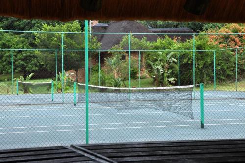a tennis court with two tennis nets on it at Legend Safaris 257A - in Kruger Park Lodge in Hazyview