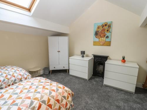 Posteľ alebo postele v izbe v ubytovaní Calder Cottage