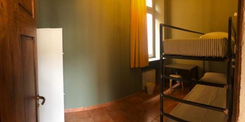 a room with a bunk bed and a window at Casa Conte Rosso in Avigliana