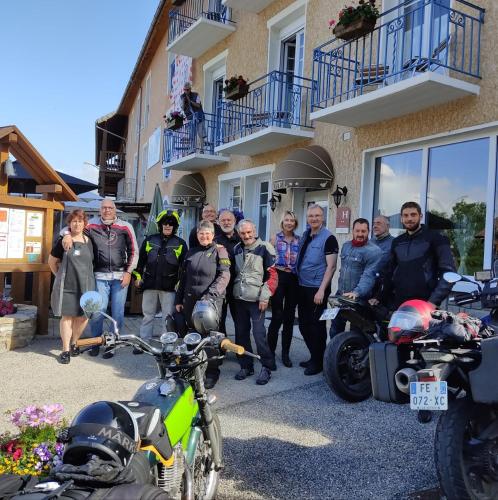 a group of people standing in front of a building at Les Fauvettes in Saint-Léger-les-Mélèzes