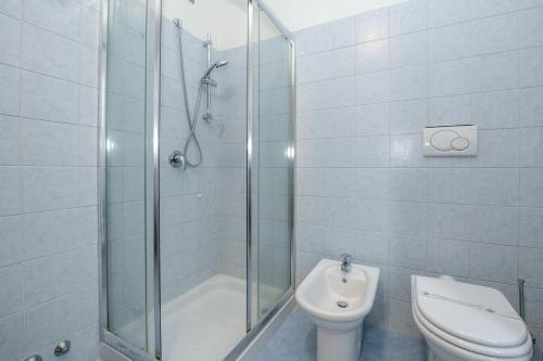 a bathroom with a shower and a toilet at Albergo Locanda Primavera in Rodengo Saiano