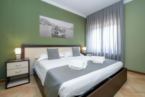 a bedroom with a large bed and a window at Albergo Locanda Primavera in Rodengo Saiano