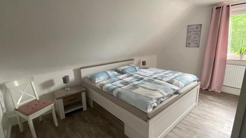 En eller flere senge i et værelse på Ferienwohnung am Bakenberg