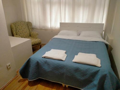 a bedroom with a bed with two towels on it at 2 bedrooms central area located appartment 1floor in Istanbul