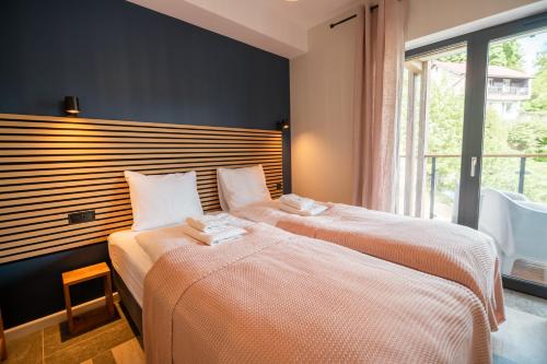 Posteľ alebo postele v izbe v ubytovaní Apart Invest Place 2 Be