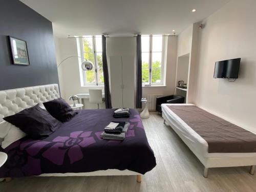 Posteľ alebo postele v izbe v ubytovaní Relais Les Loges-Etretat