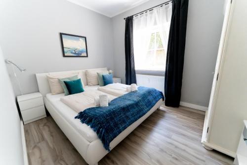 Postel nebo postele na pokoji v ubytování Velden Appartements am Wörthersee