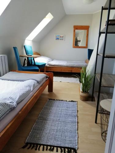 a bedroom with two bunk beds and a rug at 117 in Łeba
