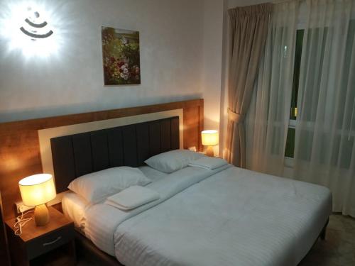 Postel nebo postele na pokoji v ubytování ريلاكس إن للشقق الفندقية Relax Inn Hotel Appartment