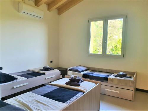 Postel nebo postele na pokoji v ubytování Villa Joana