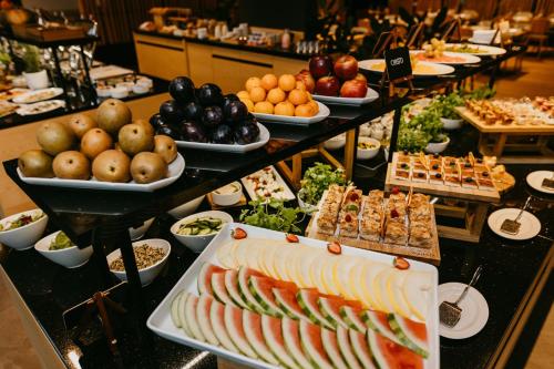 a buffet line with many different types of food at VISLOW Resort in Wisła