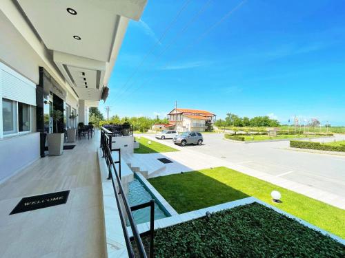 a view from the balcony of a building with a parking lot at Filippos Hotel in Halkidona
