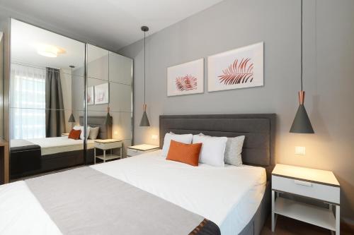 Posteľ alebo postele v izbe v ubytovaní Silver Home Apartments