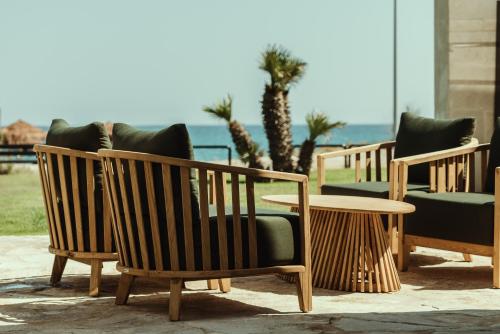 a group of chairs and a table and a table at Asterion Suites & Spa - Designed for Adults in Gerani Chanion