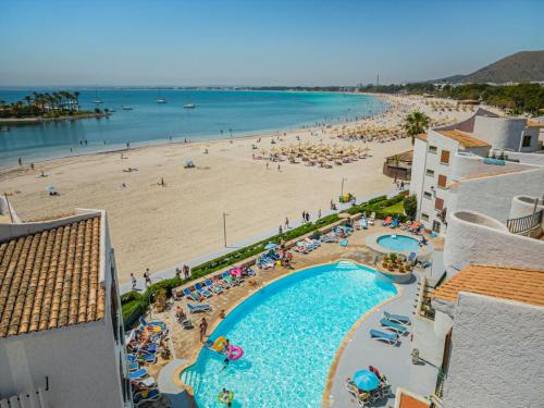 a view of the beach from the balcony of a resort at Apartamento Blue Carabela in Alcudia
