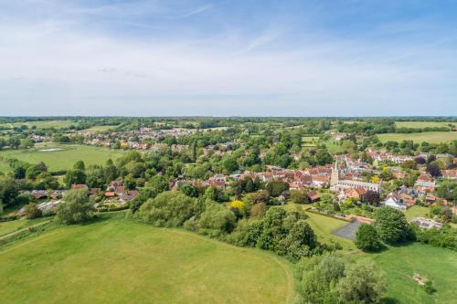 an aerial view of a small town with trees and houses at Adorable cottage with a log burner in heavenly village - Constable Lodge in Nayland