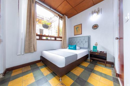 Postel nebo postele na pokoji v ubytování Ayenda Sarayu House