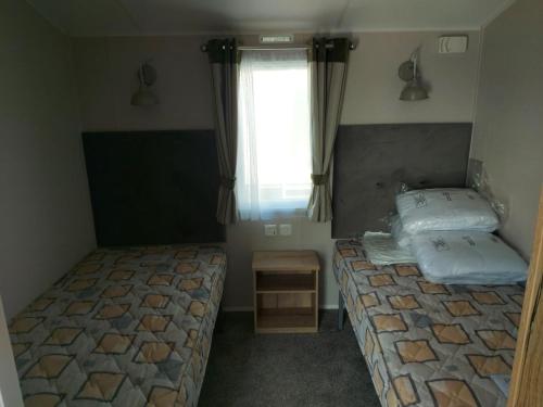 Postel nebo postele na pokoji v ubytování TLC Caravan Haven