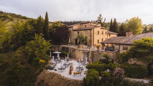 an aerial view of a building with tables and chairs at Il Casello Country House in Greve in Chianti