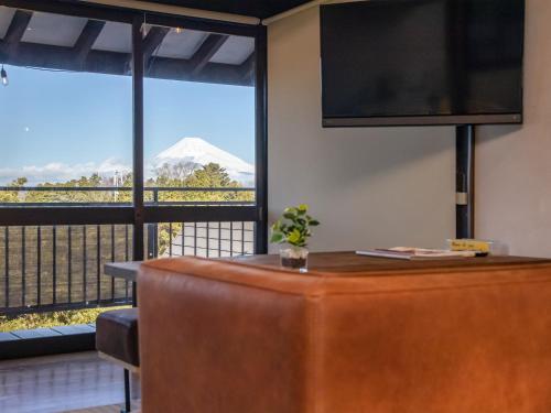 a hotel room with a view of a mountain at Izu Ricca in Izunokuni