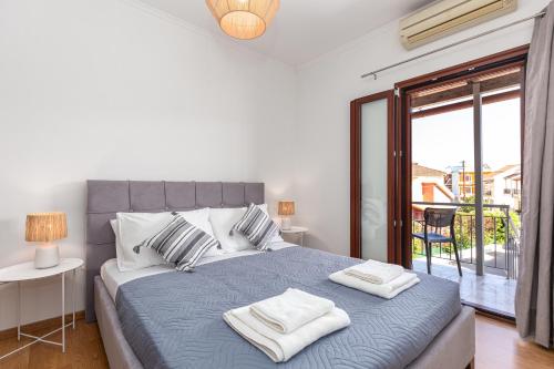 Postel nebo postele na pokoji v ubytování Casa Di Armyra - Ipsos Beach