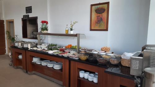 a kitchen with a buffet of food on a counter at Pamukkale Batu Termal in Pamukkale