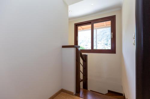 a hallway with a staircase and a window at Casa Di Armyra - Ipsos Beach in Ýpsos