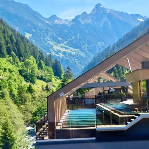 a house with a view of the mountains at ZillergrundRock Luxury Mountain Resort in Mayrhofen