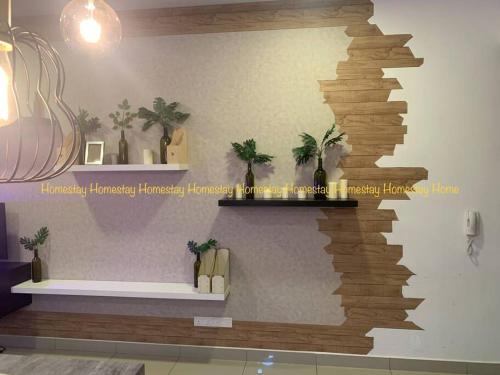 a wall with a shelf with plants on it at Couples Mind Relaxing Holiday Paradise 11 in Cyberjaya
