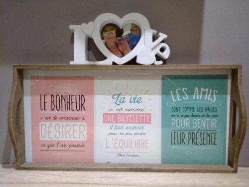 a picture frame with a sign on top of it at Chambre d'hôtes Larhun Zola in Sare