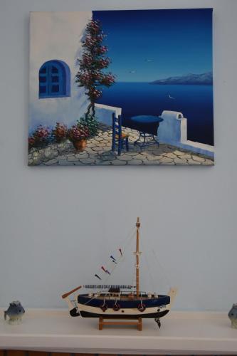 a model of a boat sitting on a table at Villa Iokasti (sea view) in Pefkali