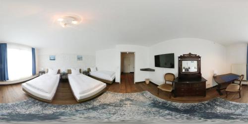 TV a/nebo společenská místnost v ubytování Hotel Am Kamp